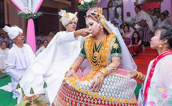 Attire for a Manipuri bride and groom